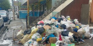 Residentes de SDO denuncian apagones constantes y acumulación de basura